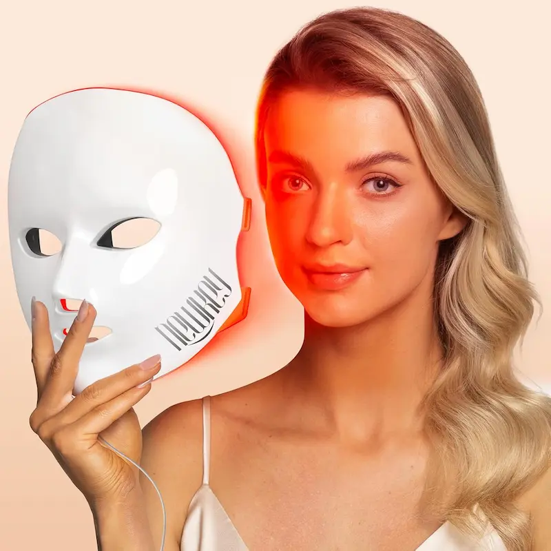 Model positioning the corded NEWKEY 4D LED mask in red-light mode before wearing it