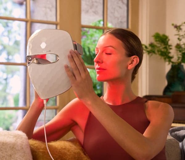 Woman wearing the exact white Ulike ReGlow UM10 mask in a clean lifestyle view.